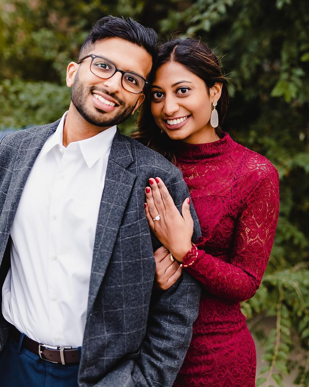 A newly engaged couple showing off their ring